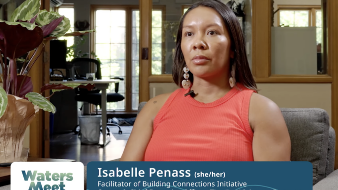 Picture of Isabelle Penass, seated alone with an office in the background.